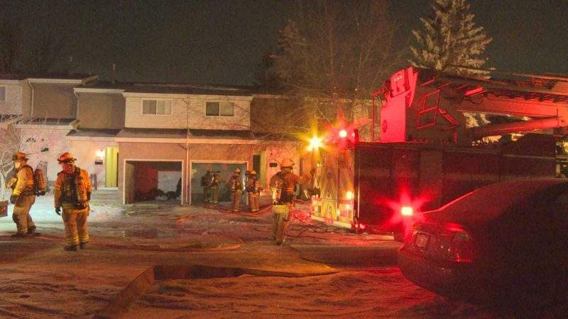 The Calgary Fire Department responds to a fire at the Radisson Village townhouse complex in the 3100 block of Radcliffe Crescent Southeast on Friday, Jan. 29, 2021.