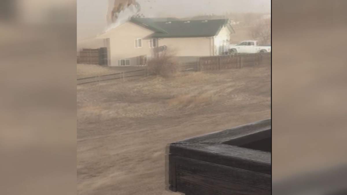 A Taber women captures the moment her neighbour’s roof blew off during severe windy weather conditions on Wednesday.