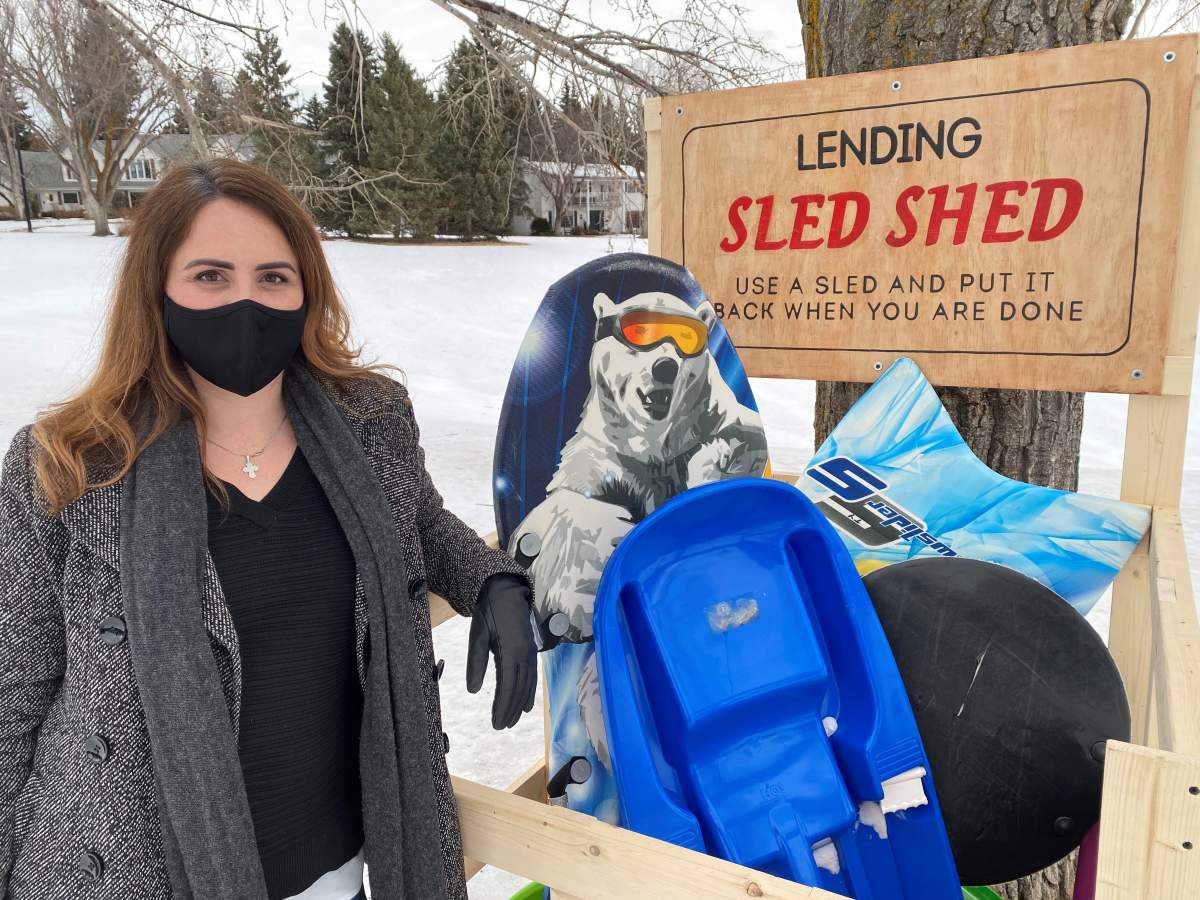 Kristie Edwardsen in front of the “Lending Sled Shed” on Jan. 19, 2021.