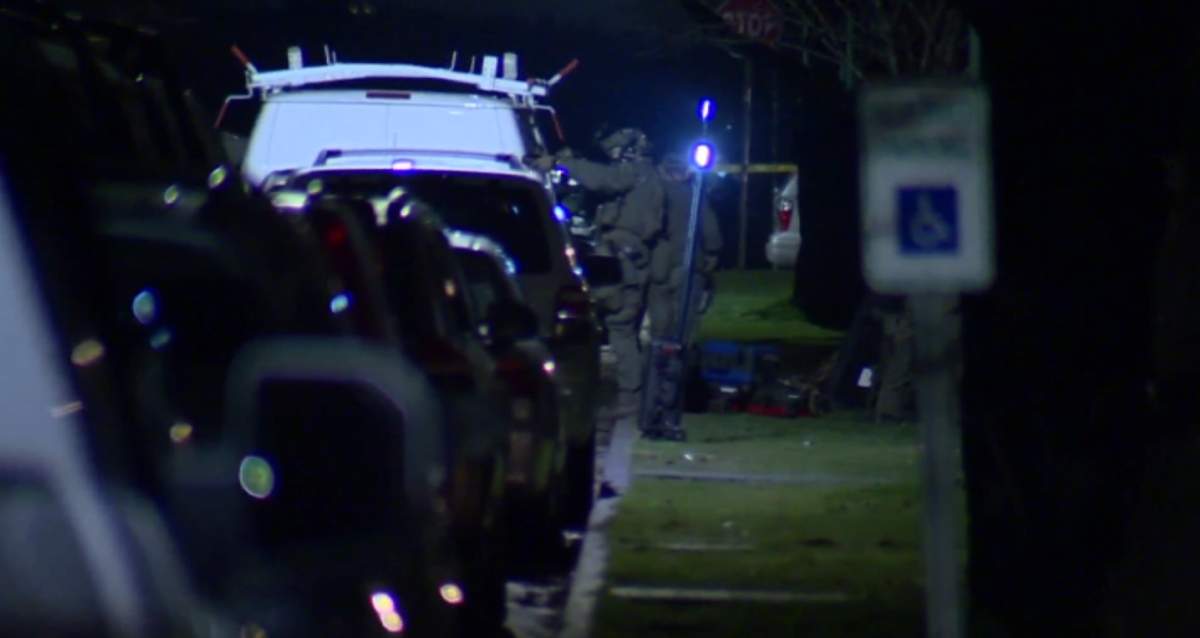 Police from across metro Vancouver, including the Emergency Response Team, surrounded a north Burnaby home for hours Thursday night.