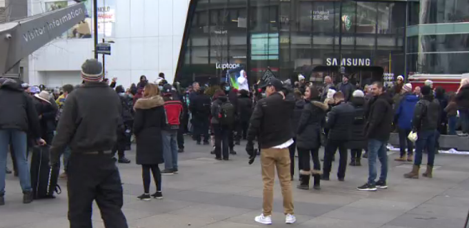 An anti-lockdown demonstration at Yonge Dundas Square .