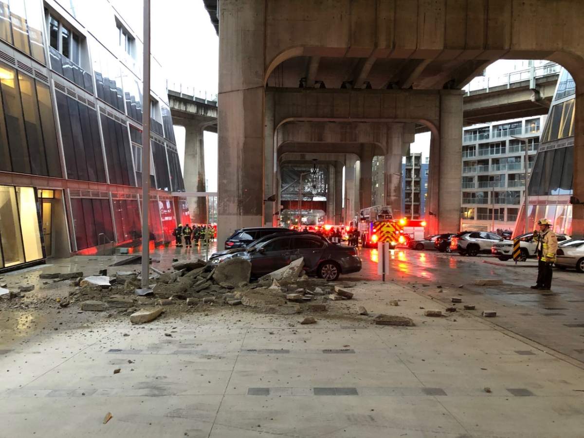 The sidewalk and several cars parked near Granville Street and Pacific Street were damaged in the explosion. Credit: Sergio Magro / Global News
