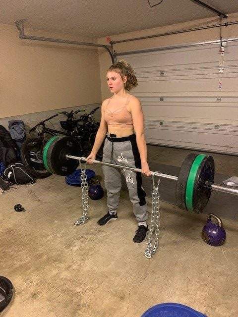 Grace Haines deadlifting in a photo provided by her family.