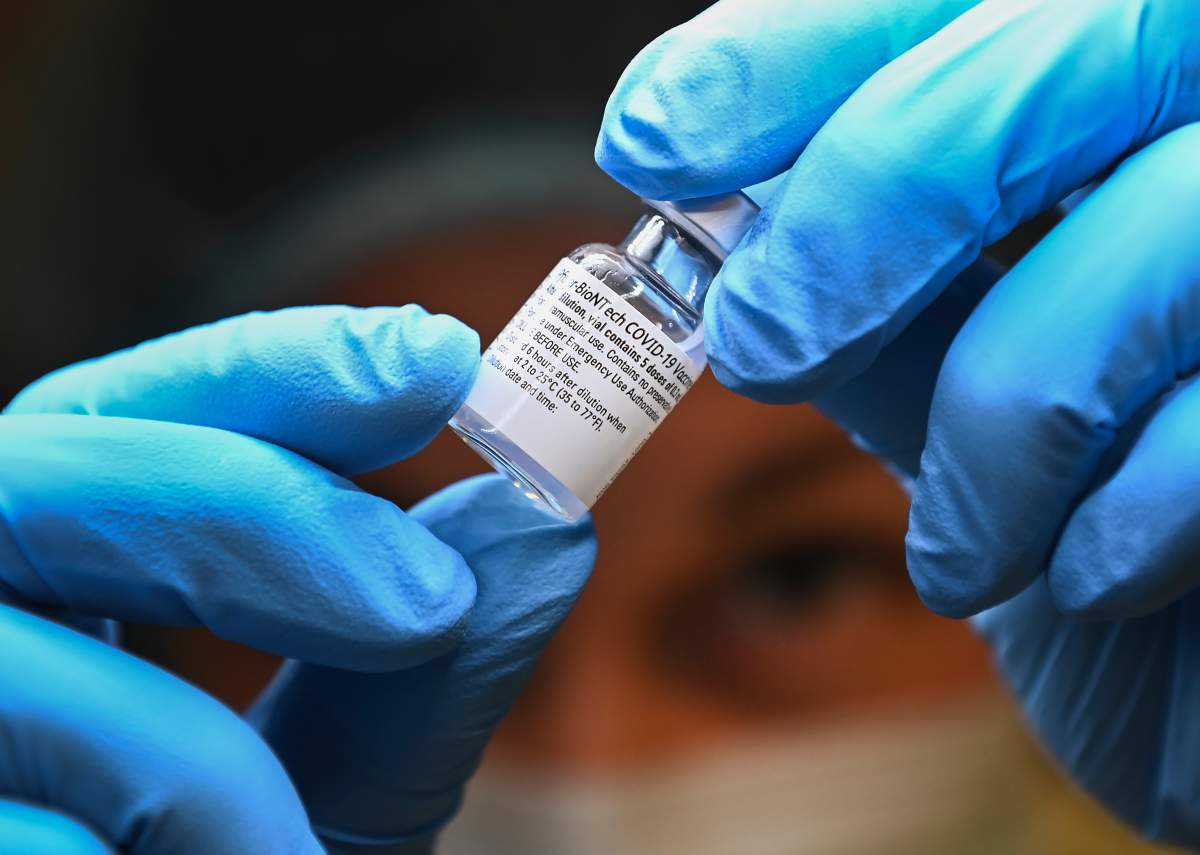 A health-care worker prepares a dose of the Pfizer-BioNTech COVID-19 vaccine in this Jan. 7, 2021 file photo.