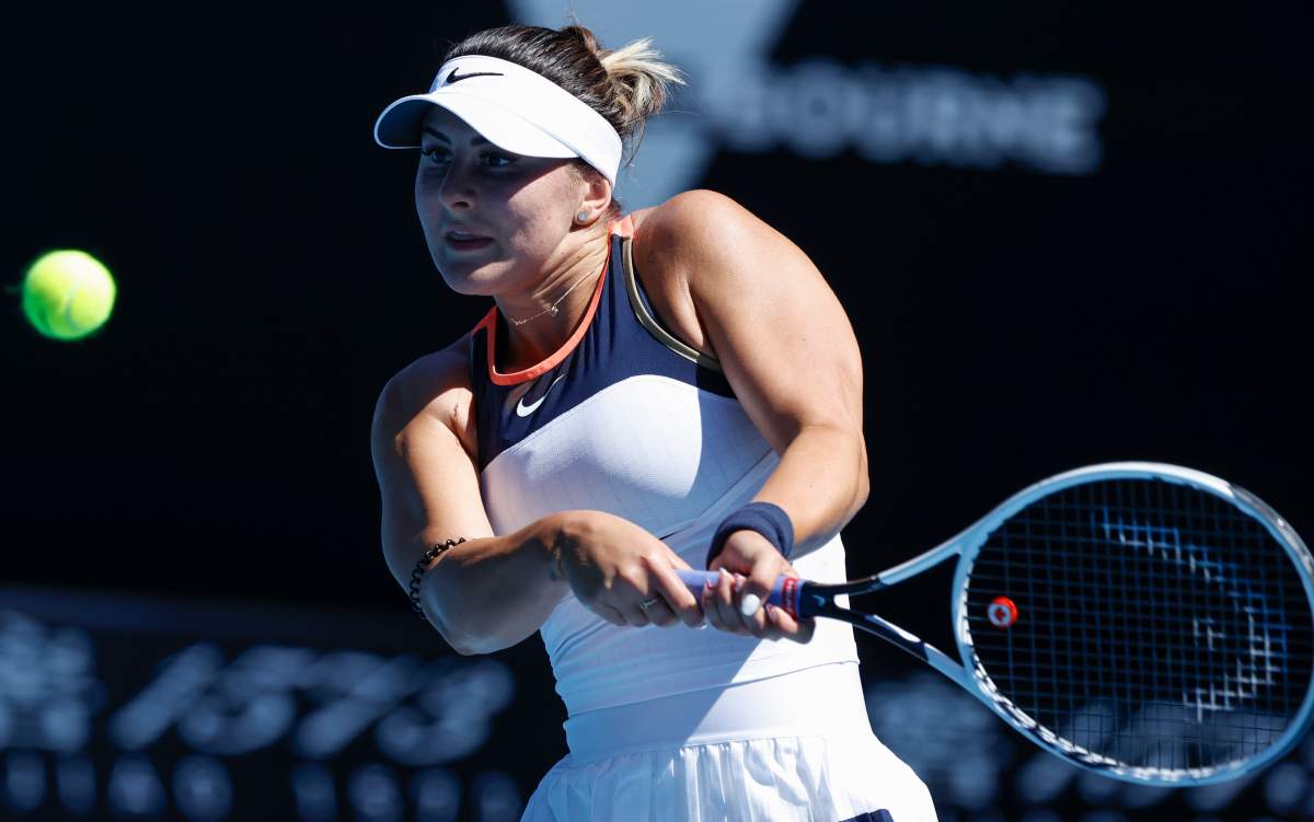 Canada's Bianca Andreescu makes a backhand return to Taiwan's Hsieh Su-Wei during their second round match at the Australian Open tennis championship in Melbourne, Australia, Wednesday, Feb. 10, 2021.