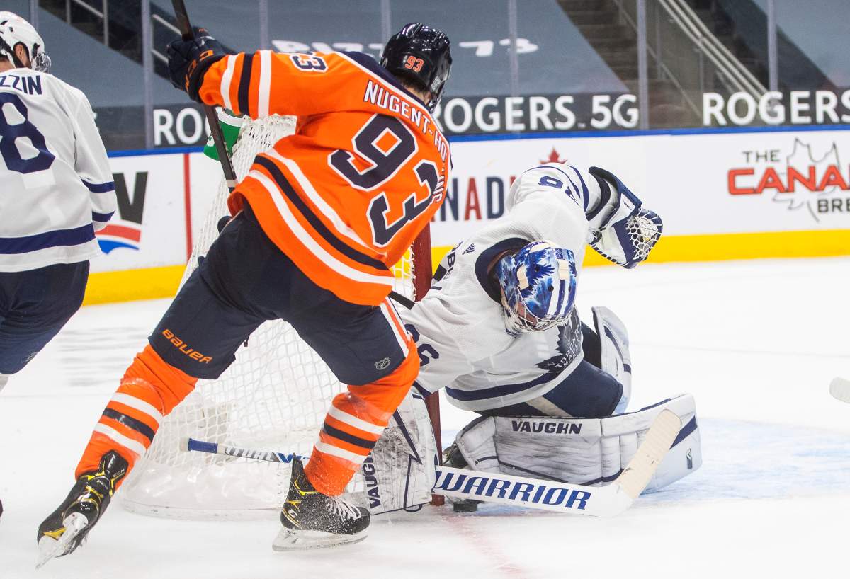 Edmonton Oilers' Ryan Nugent-Hopkins (93) is stopped by Toronto Maple Leafs goalie Jack Campbell (36) during second period NHL action in Edmonton on Saturday, February 27, 2021.THE CANADIAN PRESS/Jason Franson.