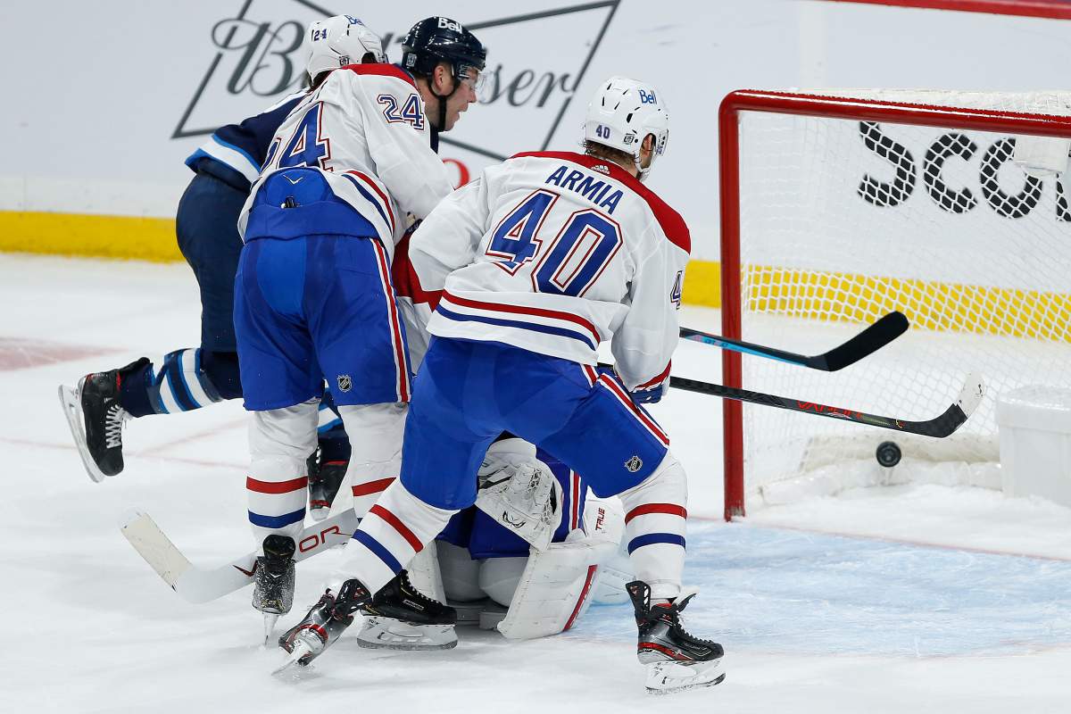 The Winnipeg Jets' Paul Stastny (25) taps in the game winner past Montreal Canadiens goaltender Jake Allen (34) in overtime NHL action in Winnipeg on Saturday, Feb. 27, 2021.