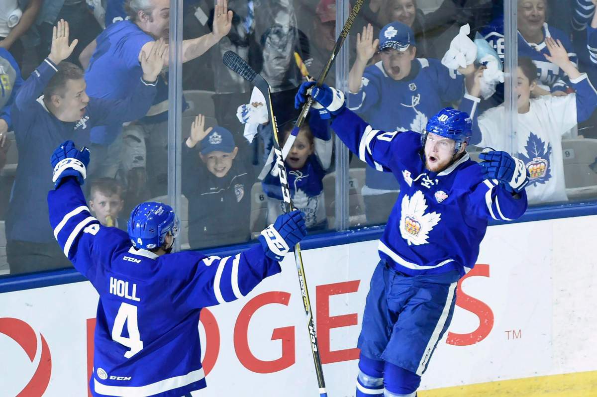 Toronto Marlies' Carl Grundstrom celebrates his goal with teammate Justin Holl (4) during third period AHL Calder Cup playoff action against the Texas Stars in Toronto on Thursday June 14, 2018. The Marlies and the Belleville Senators were given the green light to play in the AHL Canadian division on Friday, Feb. 12, 2021. 