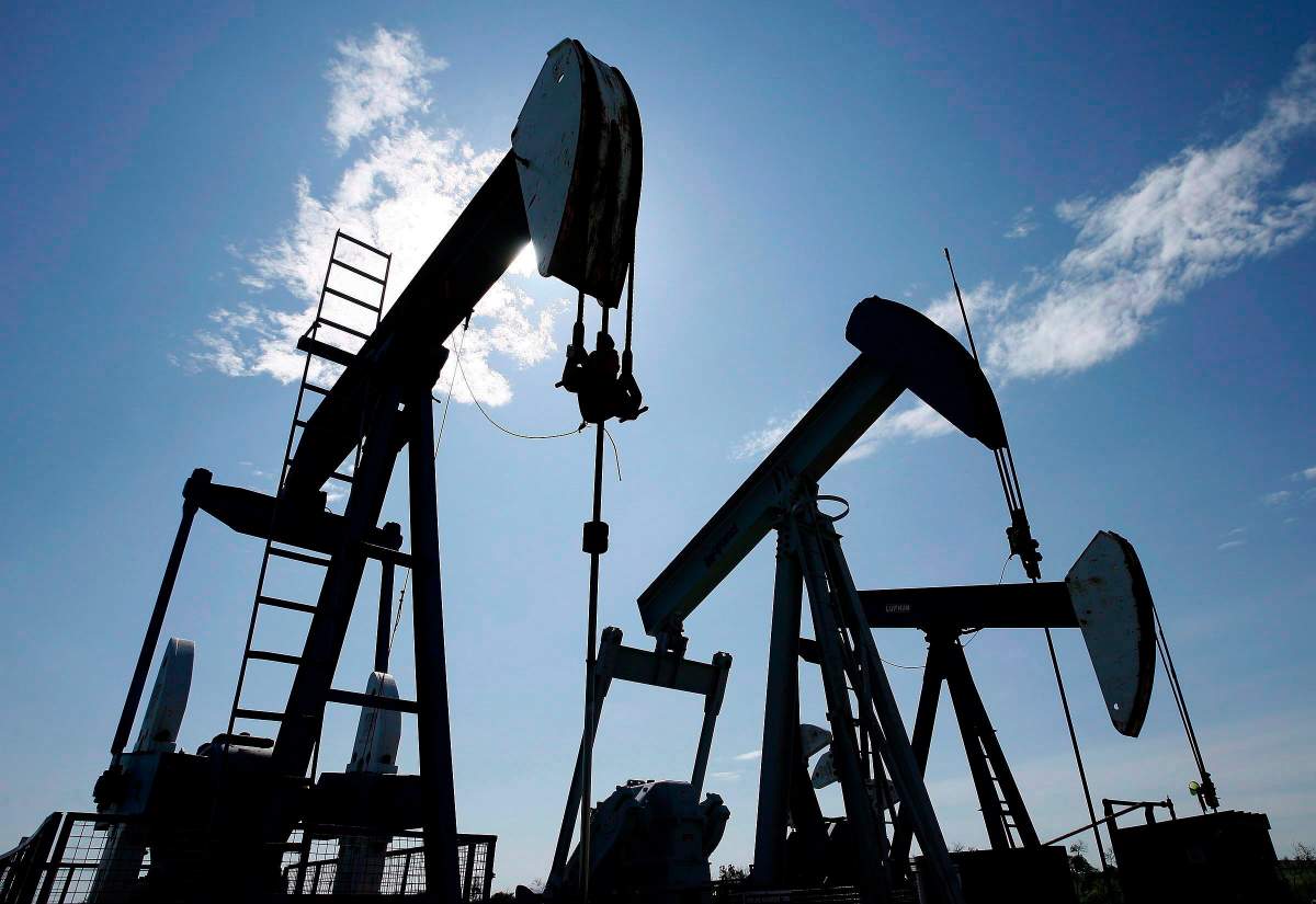 Pumpjacks at work pumping crude oil near Halkirk, Alta., June 20, 2007. 