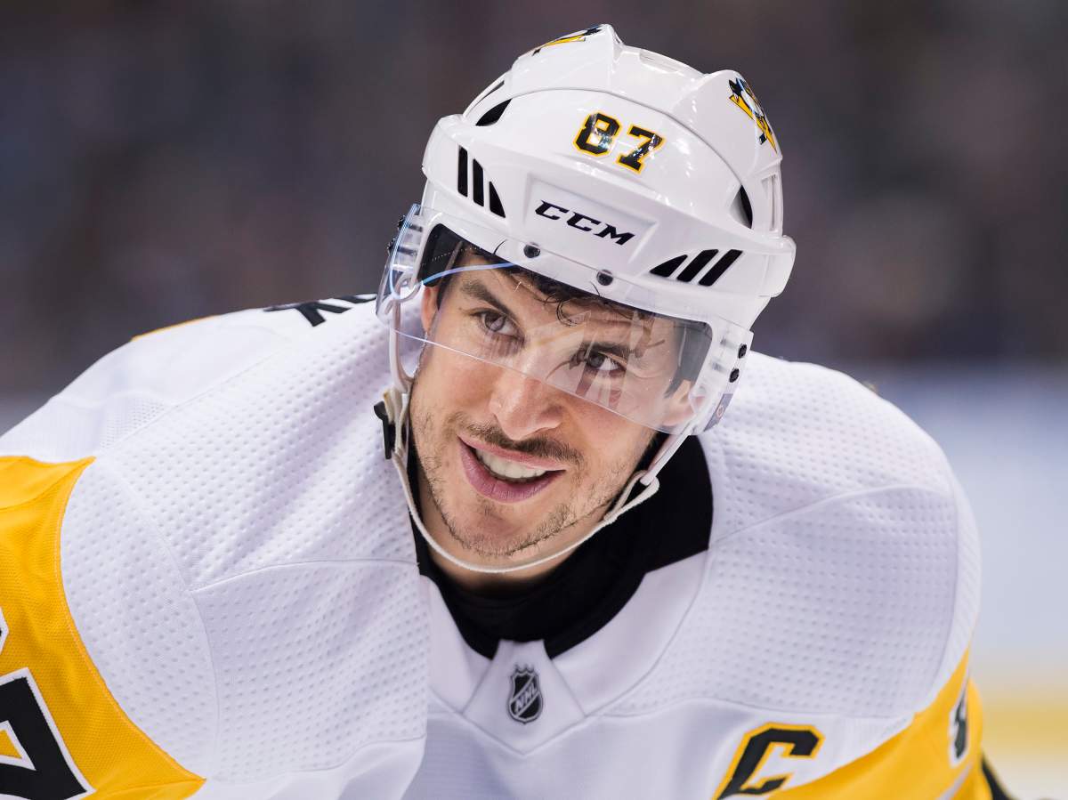 Pittsburgh Penguins centre Sidney Crosby smiles in the face-off circle while playing against the Toronto Maple Leafs during third period NHL hockey action in Toronto on Thursday, February 20, 2020. THE CANADIAN PRESS/Nathan Denette
