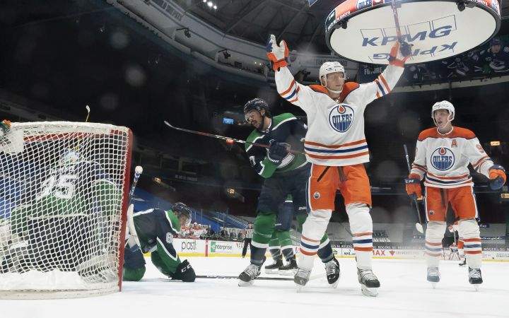 Edmonton Oilers right wing Alex Chiasson (39) celebrates his goal on Vancouver Canucks goaltender Thatcher Demko (35) during second period NHL action in Vancouver, Thursday, February 25, 2021.