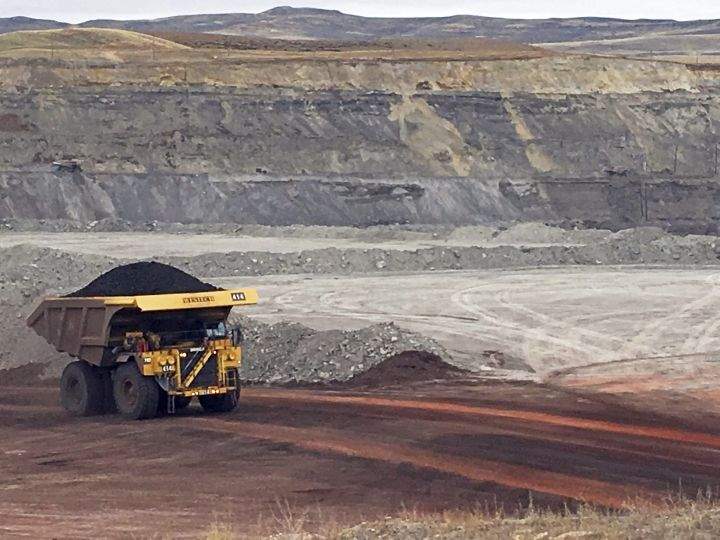 In this March 28, 2017, file photo, a dump truck hauls coal at Contura Energy's Eagle Butte Mine near Gillette, Wyo. The Alberta government is changing coal policies to make it easier to develop open-pit mines in one of the province's most sensitive areas. 