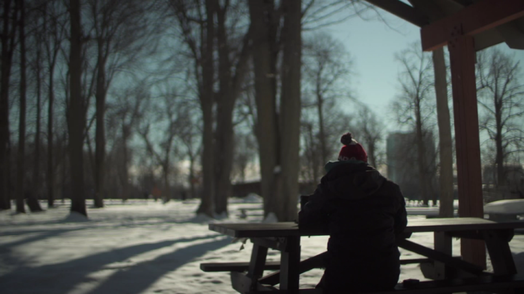A Quebec woman, seen here from behind, told Global News how her mother fell into COVID-19 conspiracy theories.