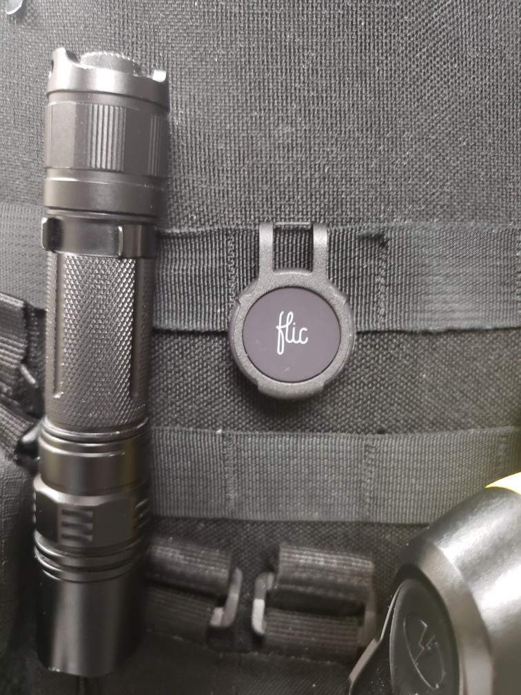 Altona police officer wearing button that enables app to start recording through their cell phone.