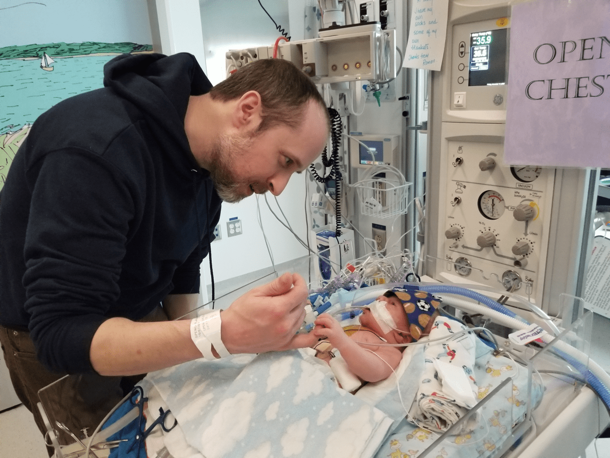 Baby Roman “charming” dad post open-heart surgery (Justina Spencer/Provided)