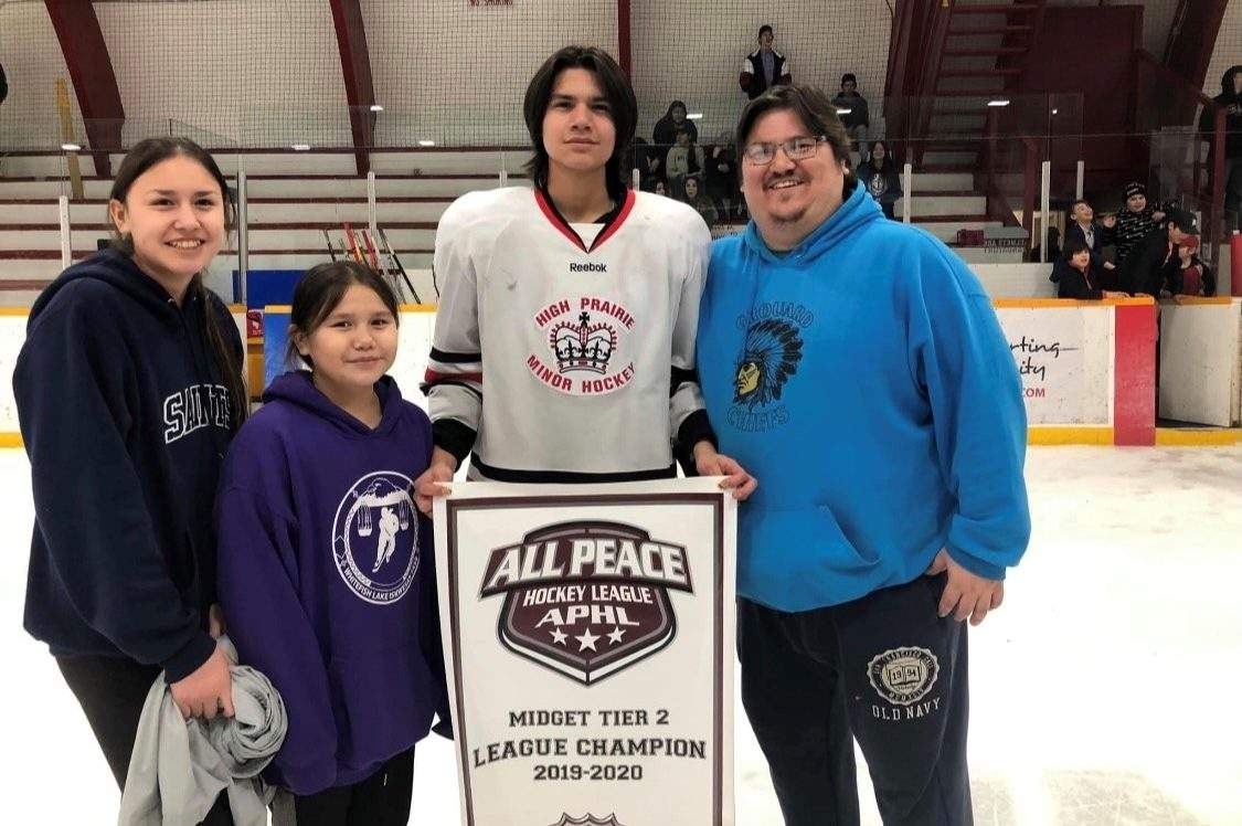Shawn Auger, supporting his young family members playing hockey.