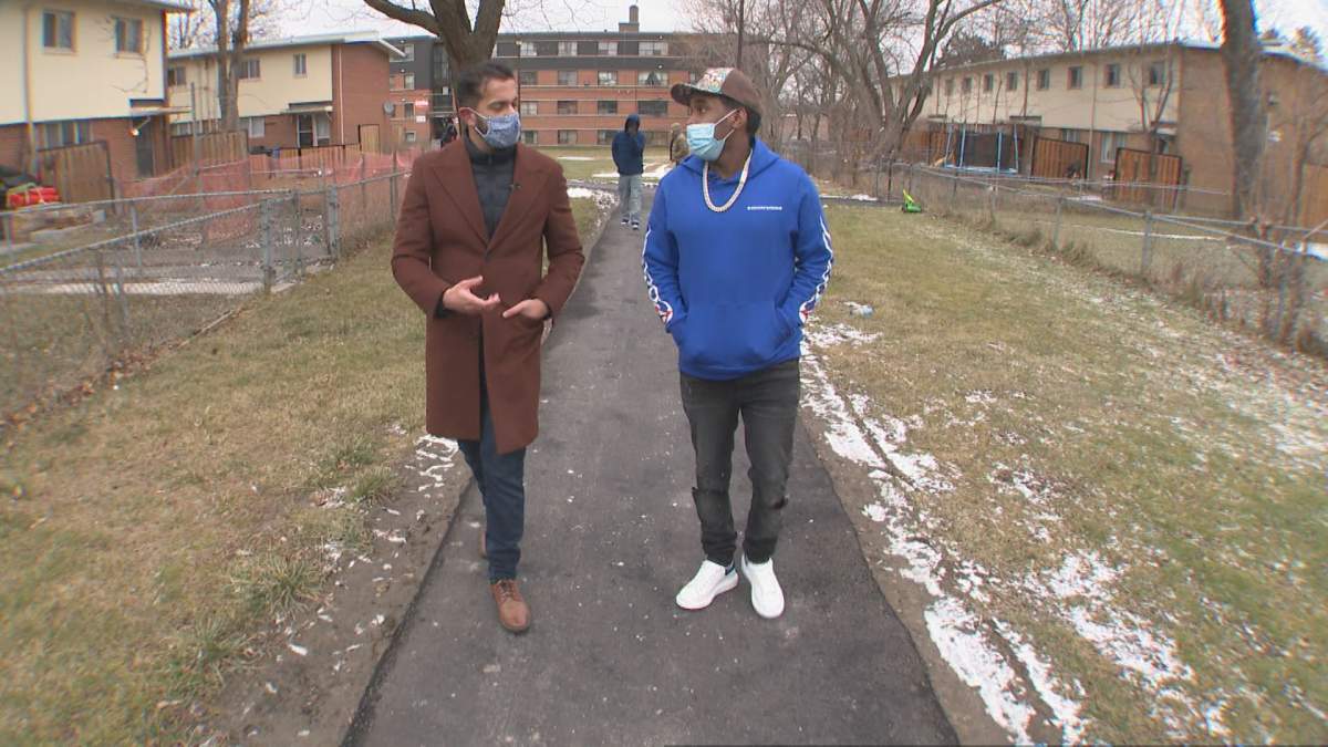Toronto rapper Top5 (right) walks through his neighbourhood of Lawrence Heights.