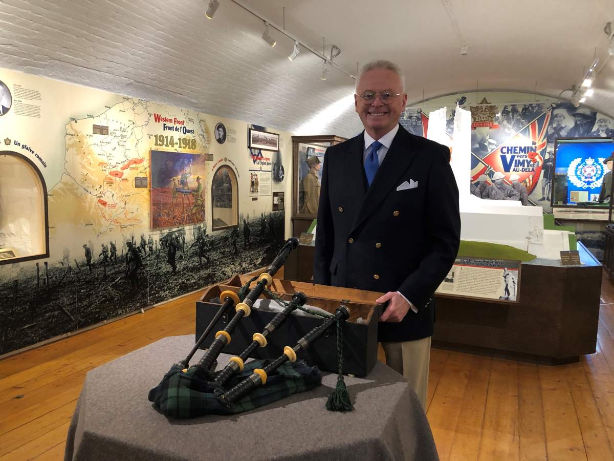 The Army Museum chief curator Ken Hynes stands next to First World War piper Michael McDougall’s 106-year-old bagpipes now on display at the museum.