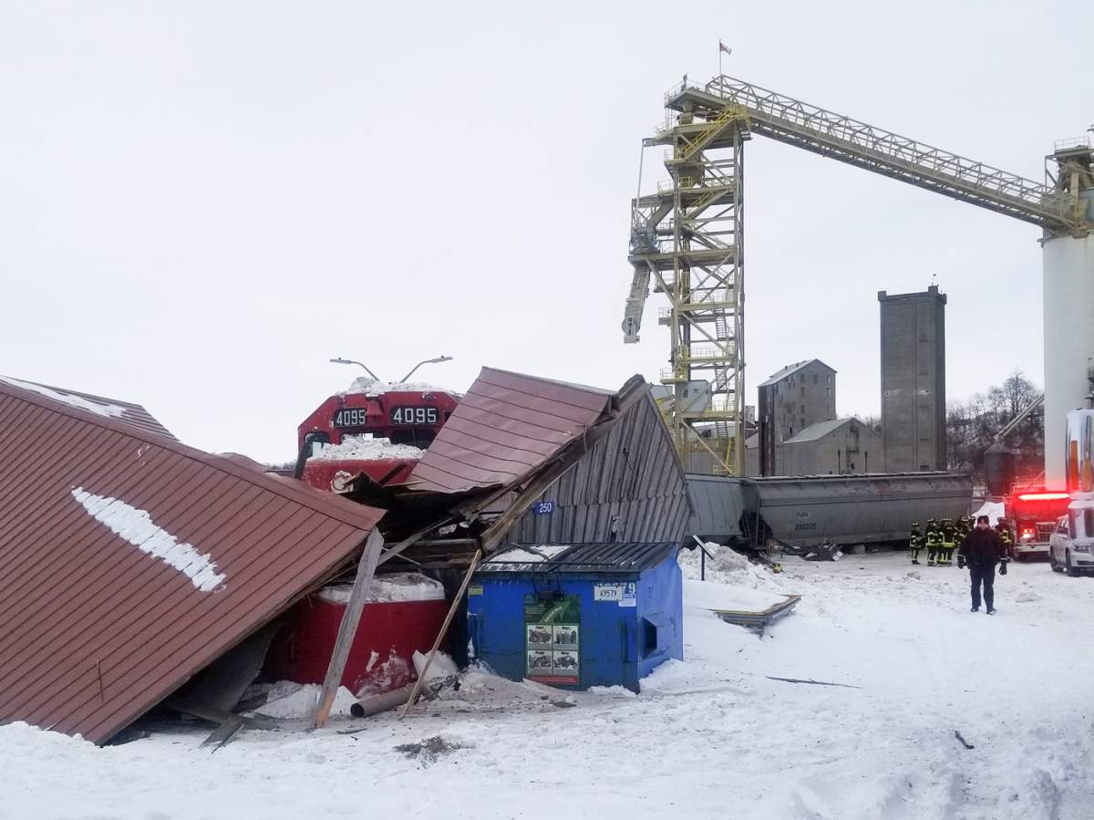 The runaway freight train derailed and crashed into a small building nearby.