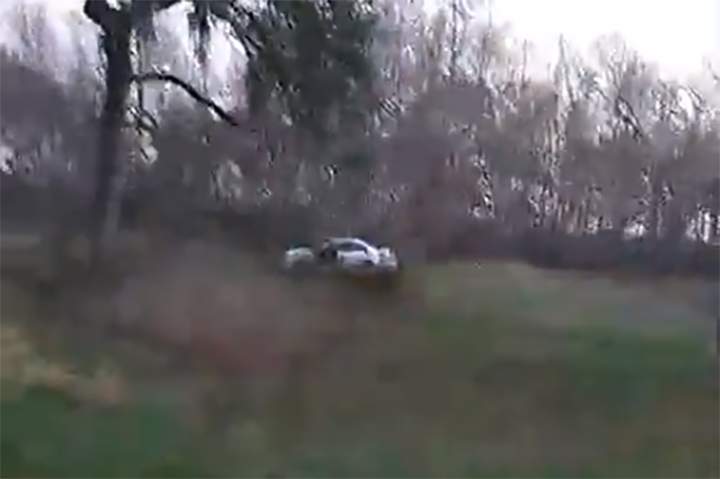 A silver sedan is shown in a field off the road near New Iberia, La., in this image from a Facebook Live video on Feb. 8, 2021.