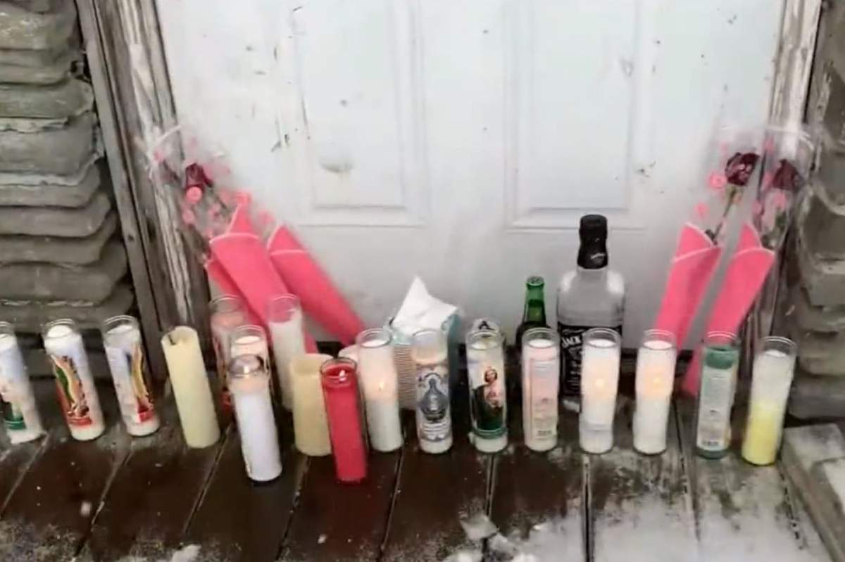 Candles and other tributes are shown outside the Pekny family diner in Liberty, N.Y., in February 2021.