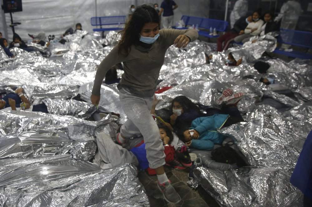 The Biden administration on Tuesday for the first time allowed journalists inside its main detention facility at the border for migrant children, revealing a severely overcrowded tent structure where more than 4,000 kids and families were crammed into pods and the youngest kept in a large play pen with mats on the floor for sleeping.