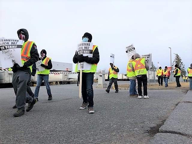 Members of Teamsters Local Union 987 of Alberta at the Coca-Cola plant in northeast Calgary walked off the job on Monday, March 15, 2021.