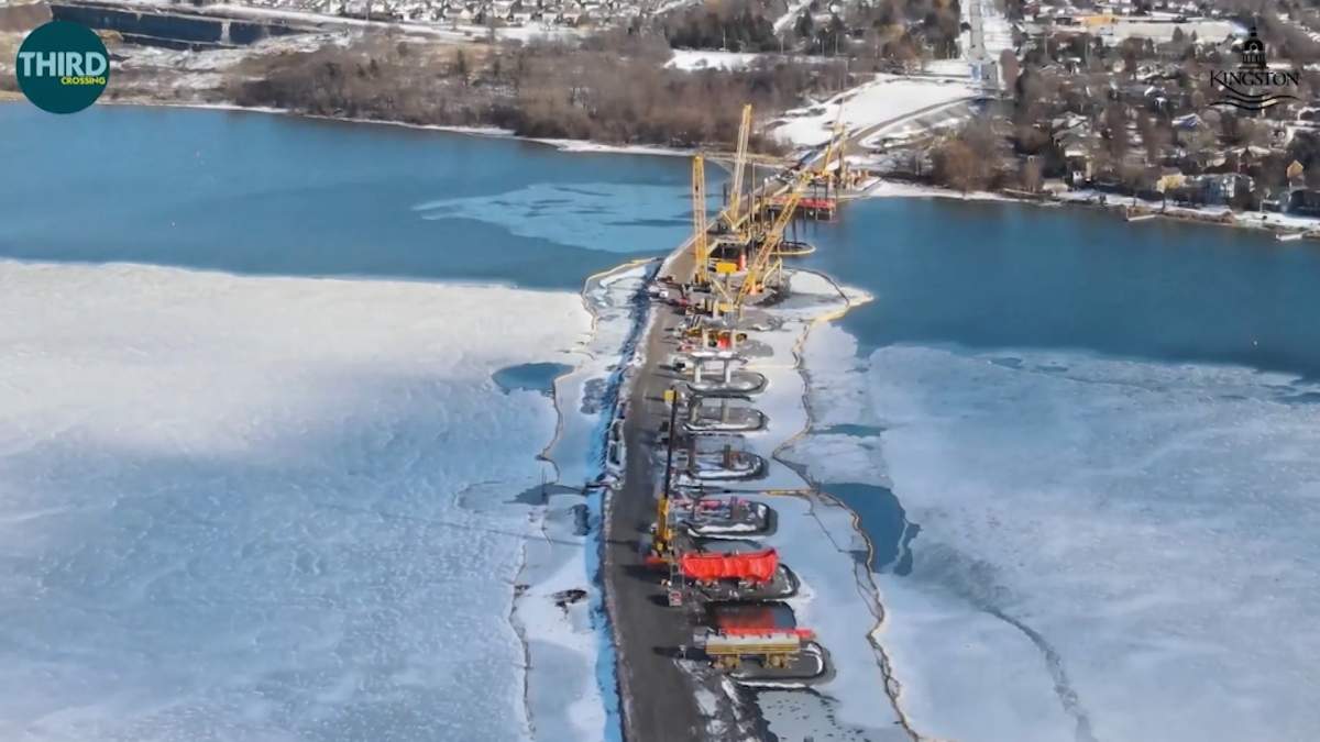 Construction of the bridge has progressed through the winter and during the COVID-19 pandemic. This March 2021 view shows the temporary lift bridge to accommodate boat traffic on the Rideau Canal’s navigation channel.