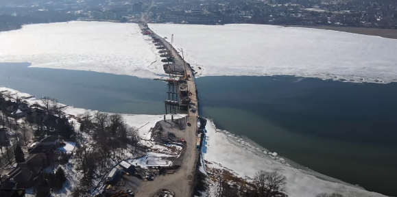 A bird's eye view of Kingston's Third Bridge crossing, seen from the eastern shore of the Cataraqui River.