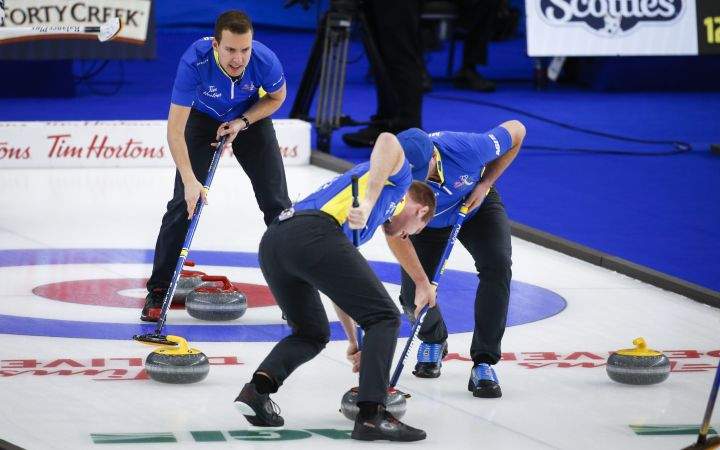 Team Alberta skip Brendan Bottcher, left, directs his team as he plays Team Wild Card Three at the Brier in Calgary, Alta., Monday, March 8, 2021.