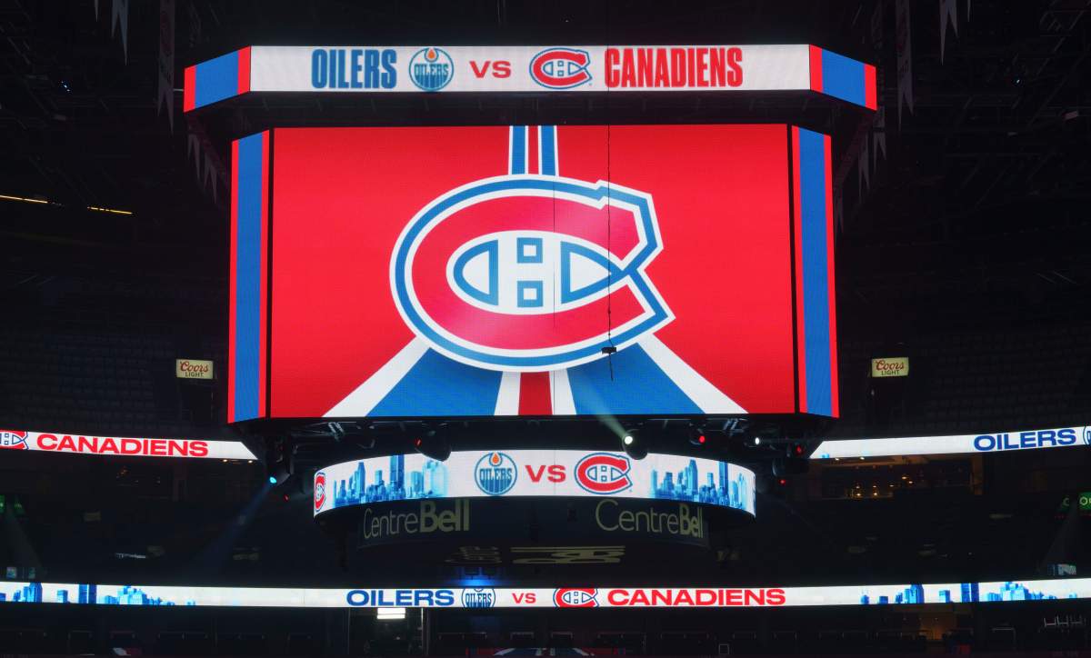 The clock at the Bell Centre shows graphics before the postponement of an NHL hockey game between the Montreal Canadiens and the Edmonton Oilers, in Montreal, Monday, March 22, 2021.