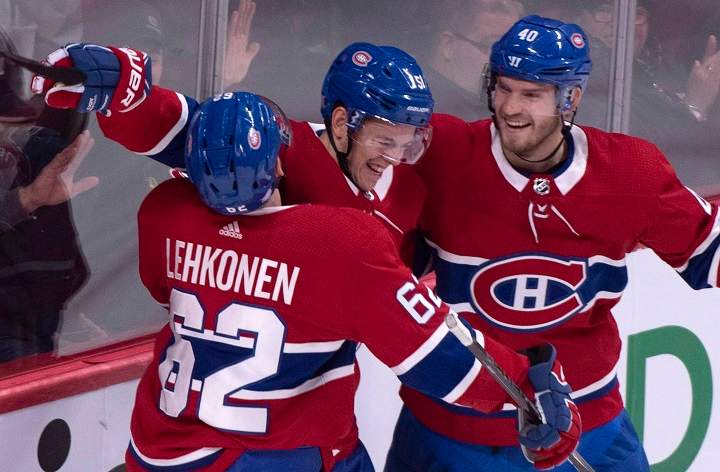 Montreal Canadiens' Jesperi Kotkaniemi, centre, celebrates his goal past Washington Capitals goaltender Braden Holtby with teammates Artturi Lehkonen, left, and Joel Armia during first period NHL hockey action in Montreal on Thursday, November 1, 2018. 