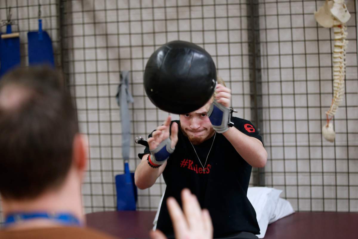Ketler works through his rehabilitation by throwing a heavy ball. John Woods/Canadian Press