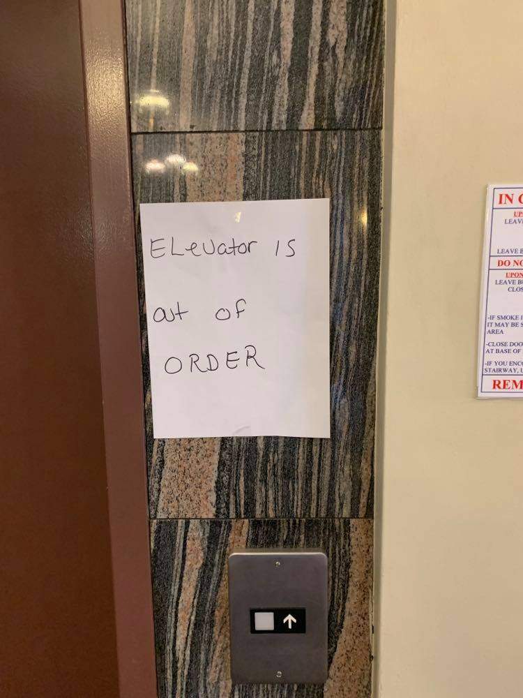 An ‘out-of-order’ sign is seen at the 16 Caxton Close apartment building in Halifax.