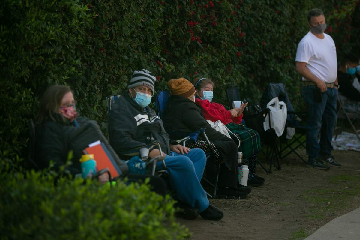 People arrived as early as 4 a.m. to claim their spot and wait all day in hopes that their will be extra doses of the COVID-19 vaccine at Kedren Health on Thursday, Feb. 11, 2021 in Los Angeles, CA.