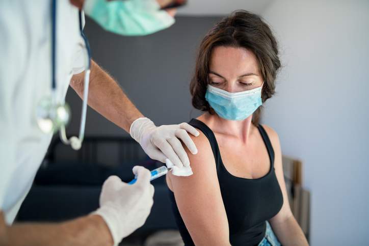 A file photo of a patient receiving a COVID-19 vaccination.