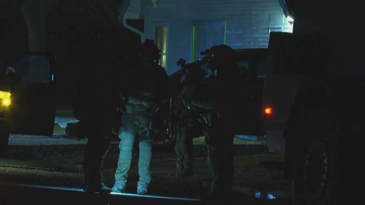 Police on the scene of a standoff in Granum on Tuesday, March 16.