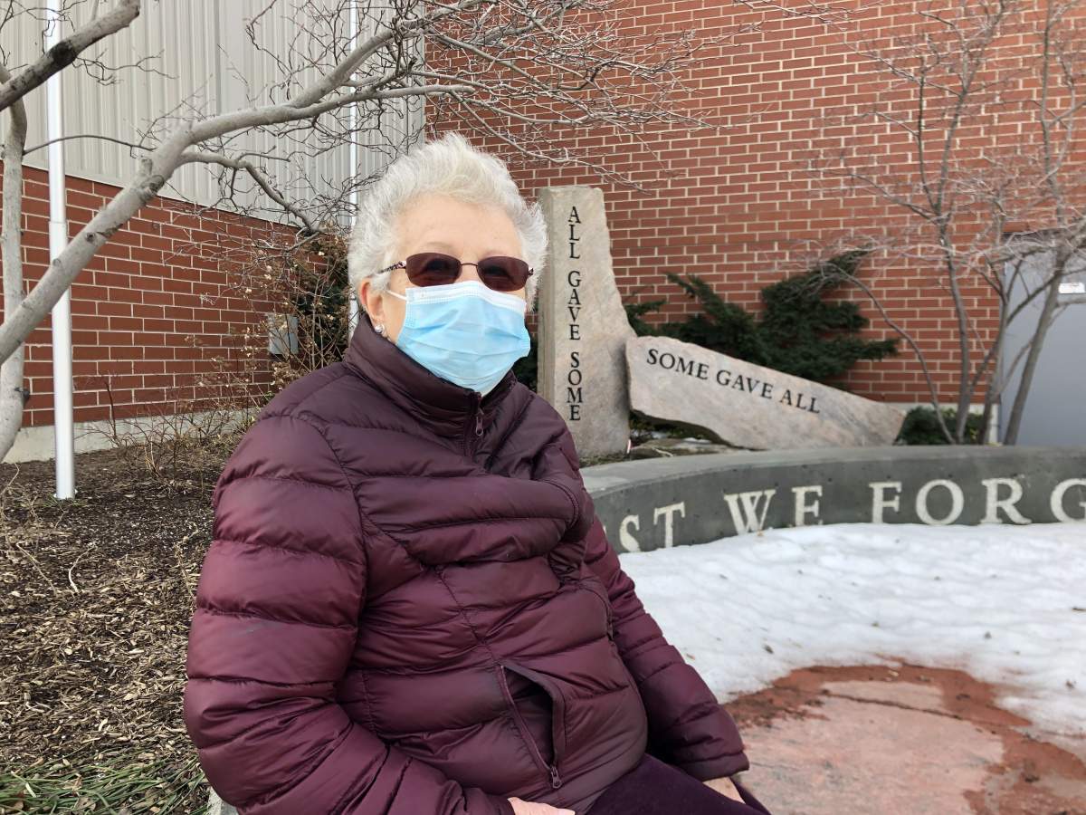 Carol Quinn, 84 waiting for her friend to get vaccinated for COVID-19 outside the Agriplex in London Ont. March 10, 2021