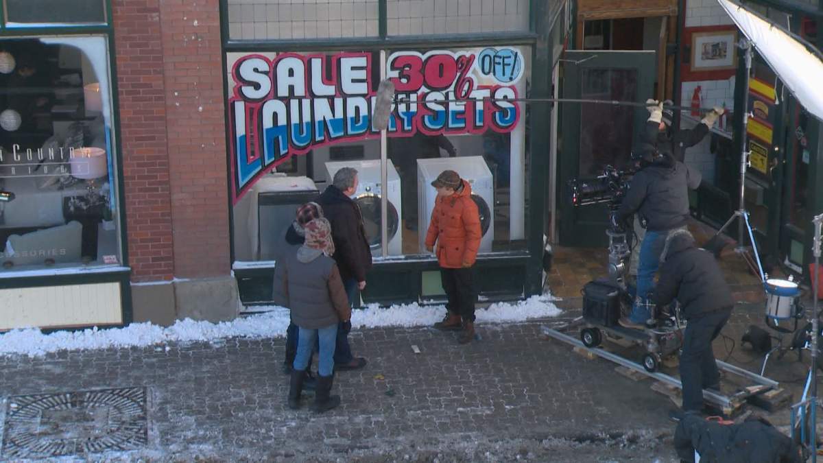 A production crew is seen shooting at a filming location in Calgary.