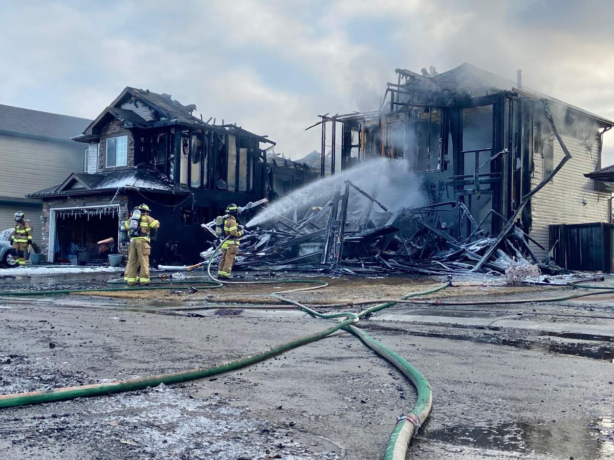 One home was destroyed and several others were damaged in a morning fire in the area of 137 Avenue and 37 Street in Edmonton Tuesday, March 23, 2021.