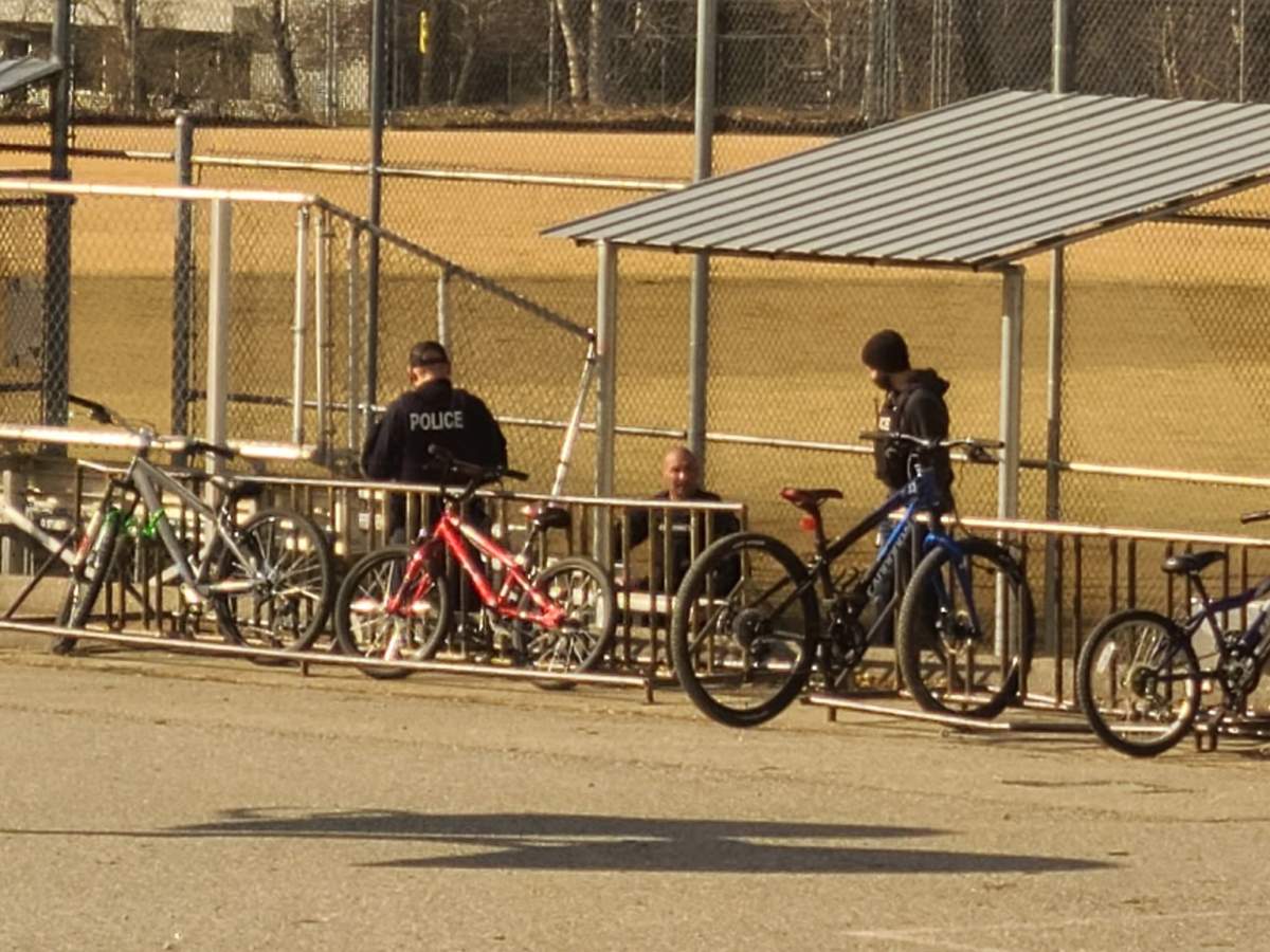 A photo showing police investigating a report of a loud explosion at Carmi Elementary School in Penticton.