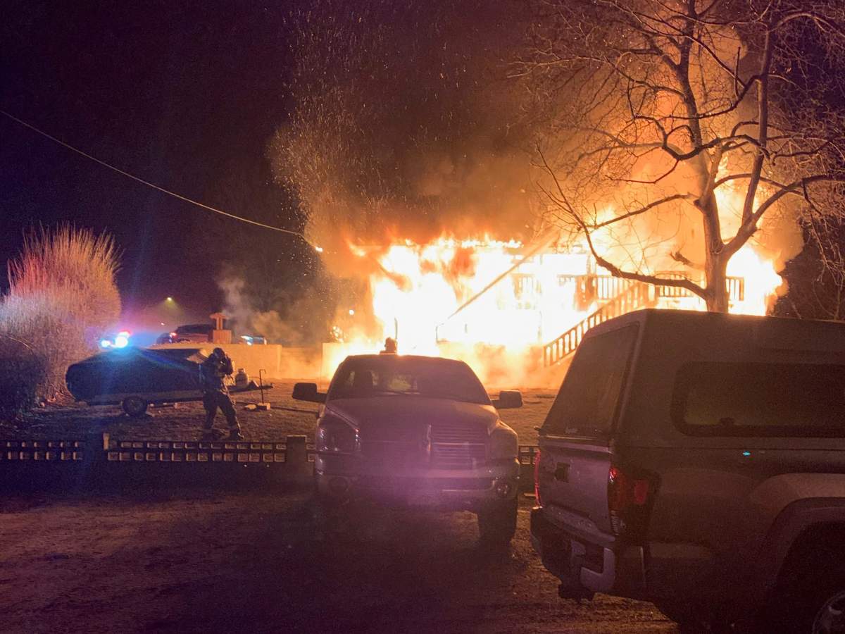 The house was engulfed in flames when firefighters arrived.