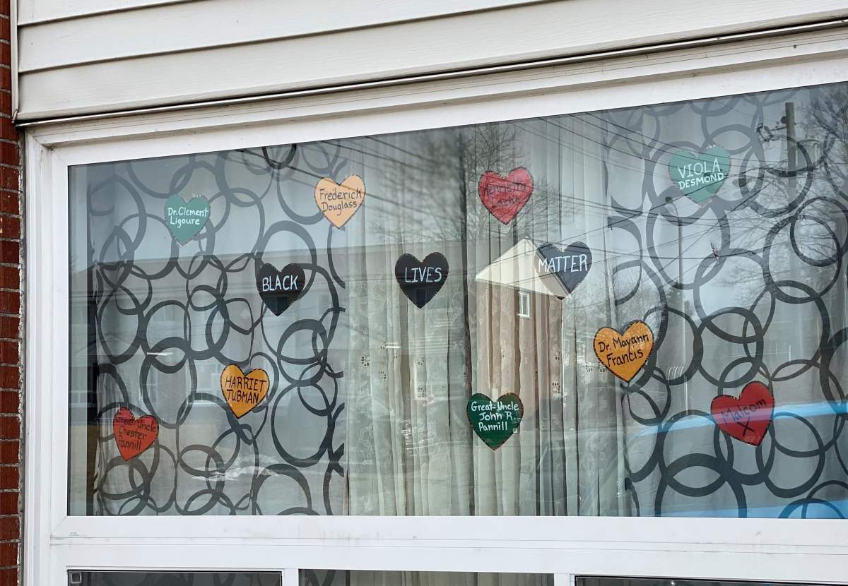 Deidra Williams and Sinclair Paynter’s living room window is seen from the courtyard.