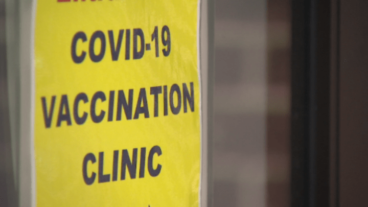 A sign for a COVID-19 vaccination clinic is seen in Newmarket, Ont.
