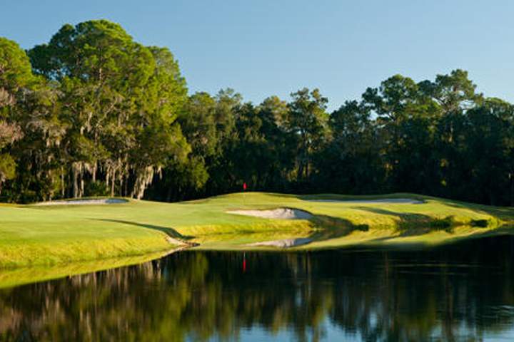 A pond is shown near the golf course at East Lake Woodlands Country Club in Oldsmar, Fla.
