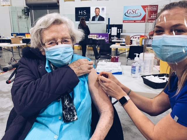Guelph nurse Annika Ferwerda administers a COVID-19 vaccine to her 91-year-old grandmother.