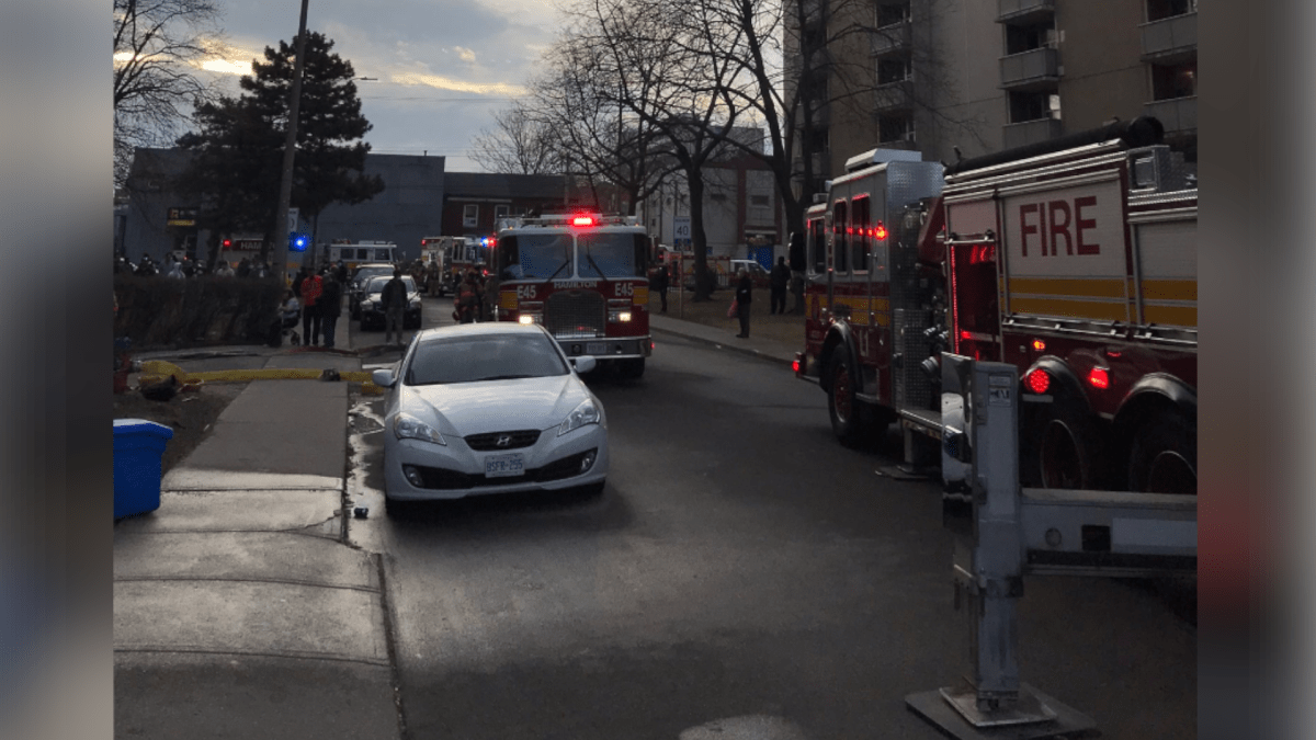 Firefighters battling a multiple-alarm blaze on Rebecca Street in Central Hamilton on March 24, 2021. 