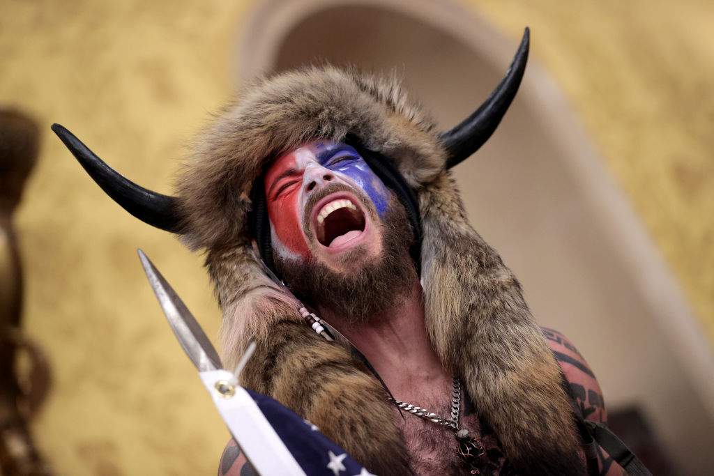 Jacob Chansley screams 'Freedom' inside the Senate chamber after the U.S. Capitol was breached by a mob during a joint session of Congress on January 06, 2021 in Washington, D.C.