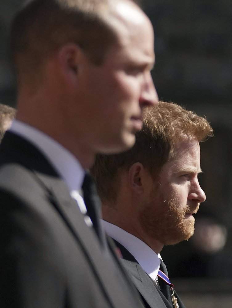 Prince William, the Duke of Cambridge and Prince Harry walk in the procession, ahead of Britain Prince Philip’s funeral at Windsor Castle, Windsor, England, Saturday April 17, 2021.