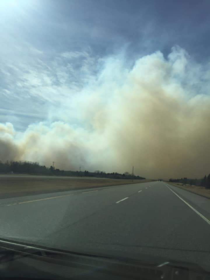 Smoke can be seen from a grass fire burning near Carberry Thursday.